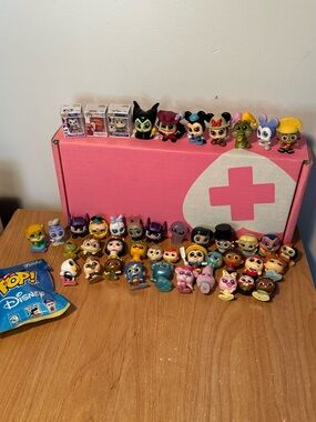 Massive lot of Disney Doorables and Funko bitty pops
